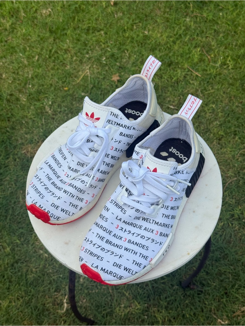 Adidas NMD R1 "The Brand with the 3 Stripes" in White.